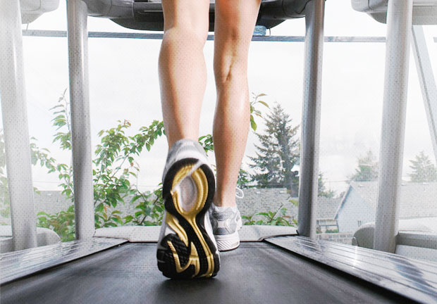 Feet walking on a treadmill